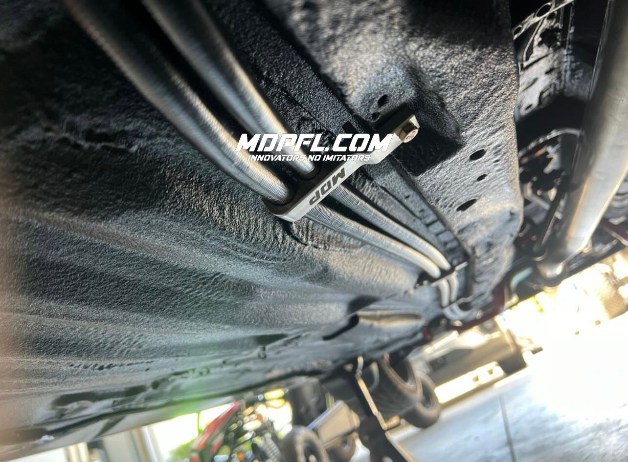 Soporte de línea de combustible y freno MDP